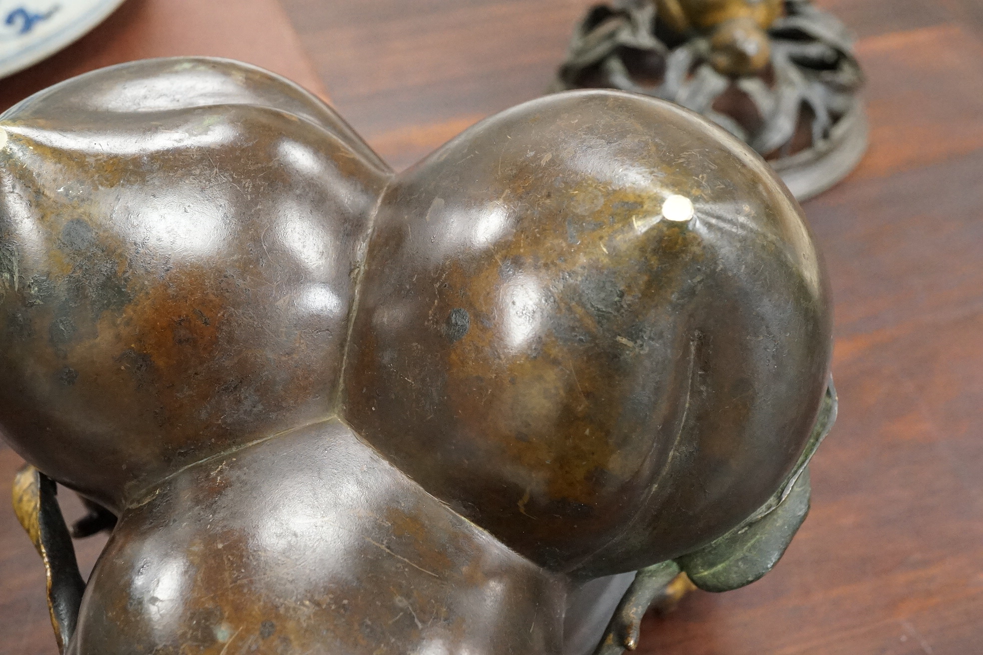 A large Chinese bronze and parcel gilt ‘peach’ censer and cover, Li, 17th/18th century